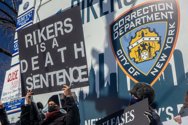 Protesters gather outside Rikers Island